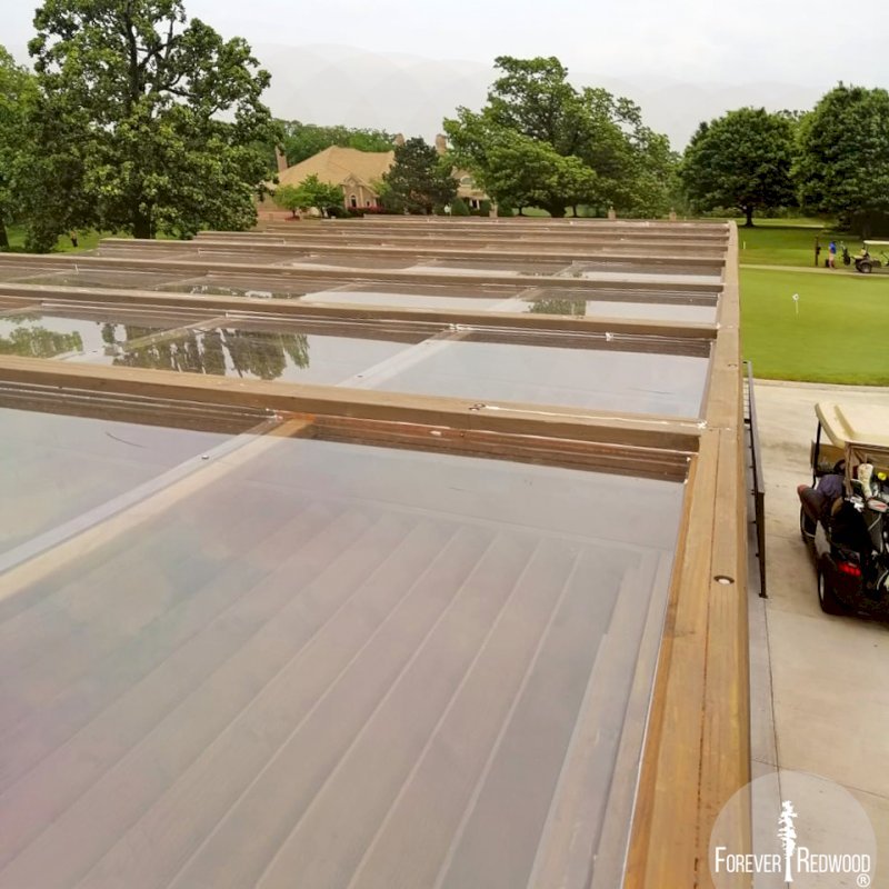 Modern Louvered Garden Pergola (Options: 44' L x 18' W, 8" x 8" Posts, Mobile Louvers, Douglas-fir, 10 ft H, No Electrical Wiring Trim, 4 Curtain Rods, 6 Post Anchor Kit for Concrete, With Clear Polycarbonate Roofing Atop Pergola Framing by Custom Request, No Post Decorative Trims, No Ceiling Fan Bases, Coffee-Stain Premium Sealant). Photo Courtesy of M. Hudson of Rogers, Arkansas. Modern Louvered Garden Pergola (Options: 44' L x 18' W, 8" x 8" Posts, Mobile Louvers, Douglas-fir, 10 ft H, No Electrical Wiring Trim, 4 Curtain Rods, 6 Post Anchor Kit for Concrete, With Clear Polycarbonate Roofing Atop Pergola Framing by Custom Request, No Post Decorative Trims, No Ceiling Fan Bases, Coffee-Stain Premium Sealant). Photo Courtesy of M. Hudson of Rogers, Arkansas.