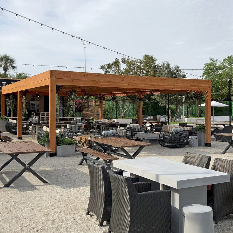 Modern Louvered Garden Pergola (Options: 40' L x 24' W, 8" x 8" Posts, Mobile Louvers, Douglas-fir, 10 ft H, No Electrical Wiring Trim, 6-Post Anchor Kit for Hurricane, No post decorative trims, No Ceiling Fan Base, Transparent Premium Sealant). Photo Courtesy of the Miami Open at Dolphins Stadium in Miami, Florida. Modern Louvered Garden Pergola (Options: 40' L x 24' W, 8" x 8" Posts, Mobile Louvers, Douglas-fir, 10 ft H, No Electrical Wiring Trim, 6-Post Anchor Kit for Hurricane, No post decorative trims, No Ceiling Fan Base, Transparent Premium Sealant). Photo Courtesy of the Miami Open at Dolphins Stadium in Miami, Florida.