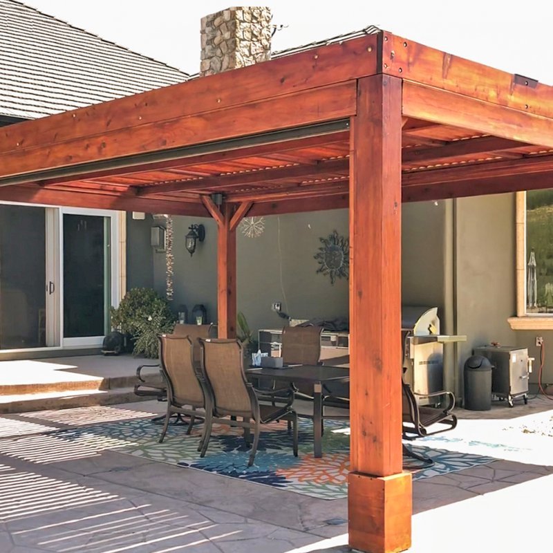 Modern Louvered Garden Pergola (Options: 20' L x 15' W, 8" x 8" Posts, Mobile Louvers, Mature Redwood, 9.5 ft H, 1 Electrical Wiring Trim, 4-Post Anchor Kit for Hurricane, No post decorative trims, No Ceiling Fan Base, Transparent Premium Sealant). Retractable Motorized Shade is a Sunroll from Sunesta Retractable Screens, for more information: https://www.sunesta.com/products/the-sunroll. Photo Courtesy of D. Ruprecht of Hollister, CA. Modern Louvered Garden Pergola (Options: 20' L x 15' W, 8" x 8" Posts, Mobile Louvers, Mature Redwood, 9.5 ft H, 1 Electrical Wiring Trim, 4-Post Anchor Kit for Hurricane, No post decorative trims, No Ceiling Fan Base, Transparent Premium Sealant). Retractable Motorized Shade is a Sunroll from Sunesta Retractable Screens, for more information: https://www.sunesta.com/products/the-sunroll. Photo Courtesy of D. Ruprecht of Hollister, CA.