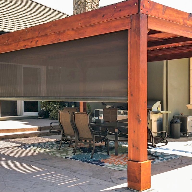 Modern Louvered Garden Pergola (Options: 20' L x 15' W, 8" x 8" Posts, Mobile Louvers, Mature Redwood, 9.5 ft H, 1 Electrical Wiring Trim, 4-Post Anchor Kit for Hurricane, No post decorative trims, No Ceiling Fan Base, Transparent Premium Sealant). Retractable Motorized Shade is a Sunroll from Sunesta Retractable Screens, for more information: https://www.sunesta.com/products/the-sunroll. Photo Courtesy of D. Ruprecht of Hollister, CA. Modern Louvered Garden Pergola (Options: 20' L x 15' W, 8" x 8" Posts, Mobile Louvers, Mature Redwood, 9.5 ft H, 1 Electrical Wiring Trim, 4-Post Anchor Kit for Hurricane, No post decorative trims, No Ceiling Fan Base, Transparent Premium Sealant). Retractable Motorized Shade is a Sunroll from Sunesta Retractable Screens, for more information: https://www.sunesta.com/products/the-sunroll. Photo Courtesy of D. Ruprecht of Hollister, CA.