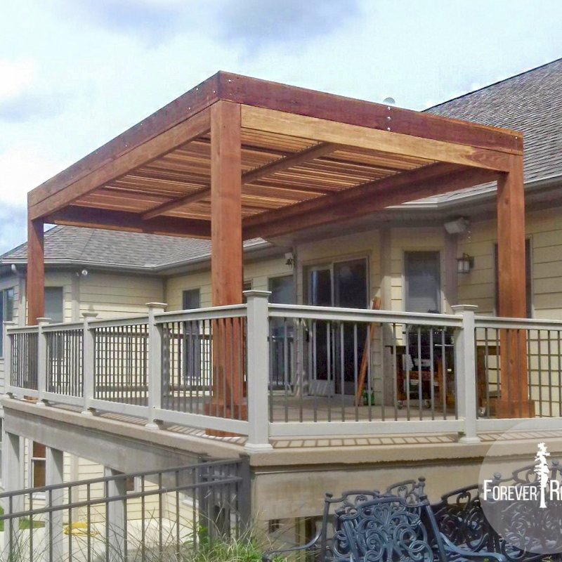 Modern Louvered Garden Pergola (Options: 20' L x 12' W, 8" x 8" Posts, Mobile Louvers, California Redwood, 9.5 ft H, 1 Electrical Wiring Trim, 1 Curtain Rod, 4 Post Anchor Kit for Concrete, No Post Decorative Trims, No Ceiling Fan Base, Transparent Premium Sealant). Photo Courtesy of N. Korte of Trenton, Illinois. Modern Louvered Garden Pergola (Options: 20' L x 12' W, 8" x 8" Posts, Mobile Louvers, California Redwood, 9.5 ft H, 1 Electrical Wiring Trim, 1 Curtain Rod, 4 Post Anchor Kit for Concrete, No Post Decorative Trims, No Ceiling Fan Base, Transparent Premium Sealant). Photo Courtesy of N. Korte of Trenton, Illinois.