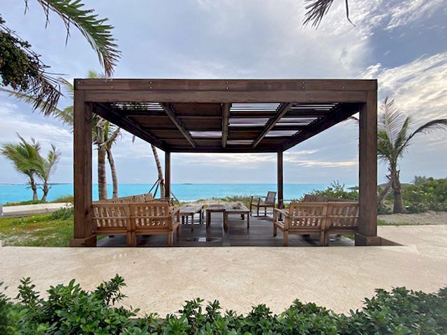 Modern Louvered Garden Pergola (Options: 16' L x 16' W, 8" x 8" Posts, Mobile Louvers, Mature Redwood, 9.5 ft H, No Electrical Wiring Trim, No Curtain Rods, 4 Post Anchor Kit for Gale-Wind, No Post Decorative Trims, No Ceiling Fan Base, Coffee-Stain Premium Sealant). Photo Courtesy of R. Dercks of Ft. Lauderdale, Florida. Modern Louvered Garden Pergola (Options: 16' L x 16' W, 8" x 8" Posts, Mobile Louvers, Mature Redwood, 9.5 ft H, No Electrical Wiring Trim, No Curtain Rods, 4 Post Anchor Kit for Gale-Wind, No Post Decorative Trims, No Ceiling Fan Base, Coffee-Stain Premium Sealant). Photo Courtesy of R. Dercks of Ft. Lauderdale, Florida.