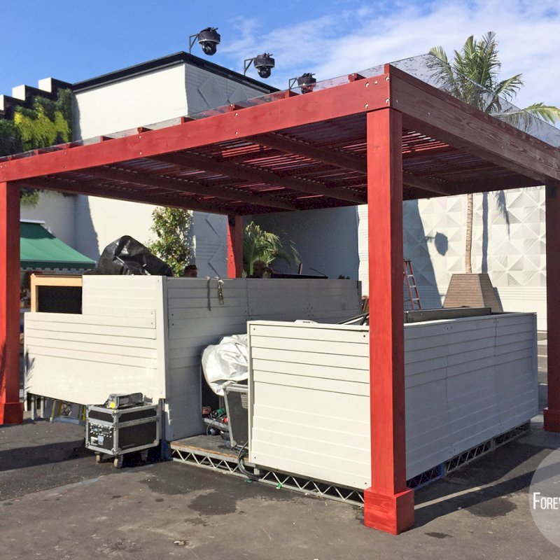 Modern Louvered Garden Pergola (Options: 14' L x 18' W, 6" x 6" Posts by Custom Request, Mobile Louvers, California Redwood, 10ft H, Electrical Wiring Trim for 1 Post, 4 Post Anchor Kit for Concrete, No post decorative trims, Add a Ceiling Fan Base, 2 Curtain Rods, Cherry Stain Premium Sealant). Photo taken by our install crews while site still in flux. Photo included her to highlight custom designed framed polycarbonate panels added as a top roof layer to make the Modern Louvered Pergola also waterproof. Photo Courtesy of Dizon of Brooklyn, NY. Modern Louvered Garden Pergola (Options: 14' L x 18' W, 6" x 6" Posts by Custom Request, Mobile Louvers, California Redwood, 10ft H, Electrical Wiring Trim for 1 Post, 4 Post Anchor Kit for Concrete, No post decorative trims, Add a Ceiling Fan Base, 2 Curtain Rods, Cherry Stain Premium Sealant). Photo taken by our install crews while site still in flux. Photo included her to highlight custom designed framed polycarbonate panels added as a top roof layer to make the Modern Louvered Pergola also waterproof. Photo Courtesy of Dizon of Brooklyn, NY.
