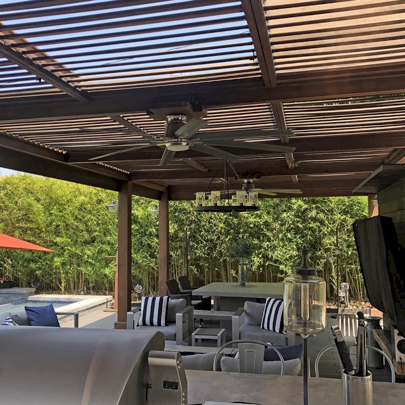 Modern Louvered Garden Pergola (Options: 29' L x 15' W, 8" x 8" Posts, Mobile Louvers, California Redwood, 9.5 ft H, 2 Electrical Wiring Trims, Curtain Rod Fascia, 8 Post Anchor Kit for Concrete, No Post Decorative Trims, 2 Ceiling Fan Bases, Coffee-Stain Premium Sealant). Photo Courtesy of M. Brown of Downey, CA. Modern Louvered Garden Pergola (Options: 29' L x 15' W, 8" x 8" Posts, Mobile Louvers, California Redwood, 9.5 ft H, 2 Electrical Wiring Trims, Curtain Rod Fascia, 8 Post Anchor Kit for Concrete, No Post Decorative Trims, 2 Ceiling Fan Bases, Coffee-Stain Premium Sealant). Photo Courtesy of M. Brown of Downey, CA.