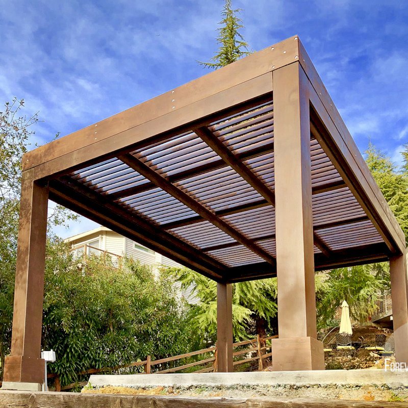 Modern Louvered Garden Pergola (Options: 16' L x 12' W, 10" x 10", Fixed Louvers, Douglas-fir, 9.5 ft H, No Electrical Wiring Trim Kit, 4 Post Anchor Kit for Concrete, No Post Decorative Trims, No Ceiling Fan Base, 4 Curtain Rods, Coffee Stain Sealant). Photo Courtesy of R. McCan of El Dorado Hills, CA Modern Louvered Garden Pergola (Options: 16' L x 12' W, 10" x 10", Fixed Louvers, Douglas-fir, 9.5 ft H, No Electrical Wiring Trim Kit, 4 Post Anchor Kit for Concrete, No Post Decorative Trims, No Ceiling Fan Base, 4 Curtain Rods, Coffee Stain Sealant). Photo Courtesy of R. McCan of El Dorado Hills, CA