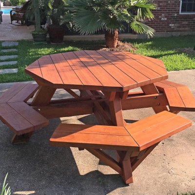 Octagonal Picnic Table (Options: 5' Diameter Tabletop, Attached Benches, Old-Growth Redwood, Standard Tabletop, Rounded Corners, No Umbrella Hole, Transparent Premium Sealant). Photo Courtesy of M. Gautier of Ocean Springs, MS.