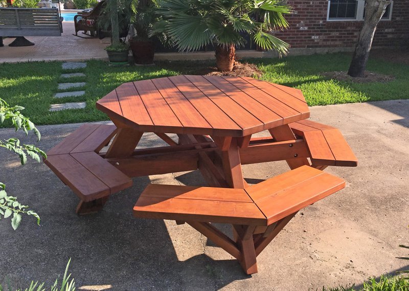 Octagonal Picnic Table (Options: 5' Diameter Tabletop, Attached Benches, Old-Growth Redwood, Standard Tabletop, Rounded Corners, No Umbrella Hole, Transparent Premium Sealant). Photo Courtesy of M. Gautier of Ocean Springs, MS. Octagonal Picnic Table (Options: 5' Diameter Tabletop, Attached Benches, Old-Growth Redwood, Standard Tabletop, Rounded Corners, No Umbrella Hole, Transparent Premium Sealant). Photo Courtesy of M. Gautier of Ocean Springs, MS.