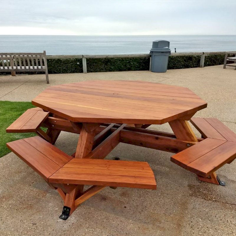 Octagonal Picnic Table (Options: 5' Diameter Tabletop, Attached Benches, California Redwood, Standard Tabletop, 1 5/8" Umbrella Hole, Transparent Premium Sealant). Photo Courtesy of G. Cooley of Dana Point, CA. Octagonal Picnic Table (Options: 5' Diameter Tabletop, Attached Benches, California Redwood, Standard Tabletop, 1 5/8" Umbrella Hole, Transparent Premium Sealant). Photo Courtesy of G. Cooley of Dana Point, CA.