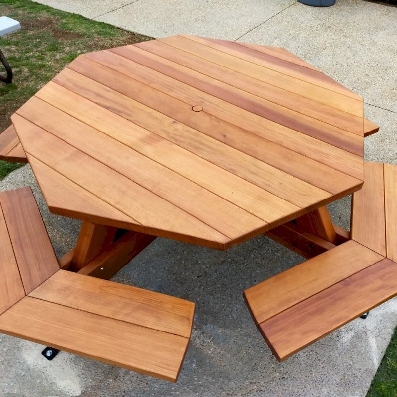 Octagonal Picnic Table (Options: 5' Diameter Tabletop, Attached Benches, California Redwood, Standard Tabletop, 1 5/8" Umbrella Hole, Transparent Premium Sealant). Photo Courtesy of G. Cooley of Dana Point, CA. Octagonal Picnic Table (Options: 5' Diameter Tabletop, Attached Benches, California Redwood, Standard Tabletop, 1 5/8" Umbrella Hole, Transparent Premium Sealant). Photo Courtesy of G. Cooley of Dana Point, CA.