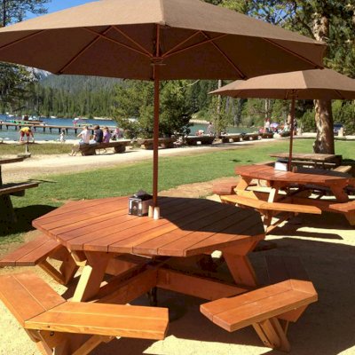 Octagonal Picnic Tables (Options: 6' Diameter Tabletop, Attached Benches, Douglas-fir, Standard Tabletop, Rounded Corners, Umbrella Hole, Transparent Premium Sealant). Photo Courtesy of Jeff C. of Stanley, Idaho.