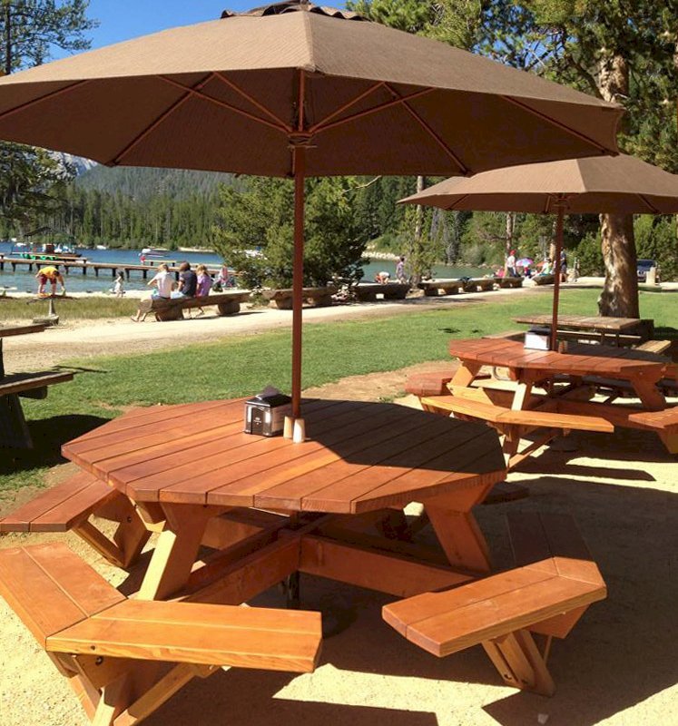 Octagonal Picnic Tables (Options: 6' Diameter Tabletop, Attached Benches, Douglas-fir, Standard Tabletop, Rounded Corners, Umbrella Hole, Transparent Premium Sealant). Photo Courtesy of Jeff C. of Stanley, Idaho. Octagonal Picnic Tables (Options: 6' Diameter Tabletop, Attached Benches, Douglas-fir, Standard Tabletop, Rounded Corners, Umbrella Hole, Transparent Premium Sealant). Photo Courtesy of Jeff C. of Stanley, Idaho.
