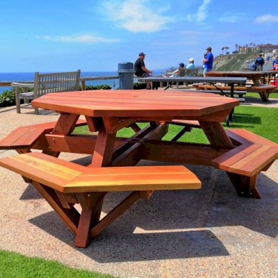 Octagonal Picnic Table (Options: 5.5' Diameter Tabletop, Attached Benches, California Redwood, Standard Tabletop, Rounded Corners, 1 5/8" Diameter Umbrella Hole, Transparent Premium Sealant). Photo Courtesy of C. Cooley of Dana Point, CA.