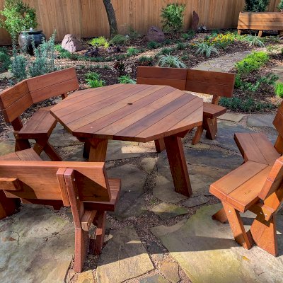 Octagonal Picnic Table (Options: 5' Diameter Tabletop, Unattached Benches [Benches with Backrests by Custom Request], Mature Redwood, Standard Tabletop, Rounded Corners, 1 5/8" Umbrella Hole, Transparent Premium Sealant). Photo Courtesy of Don and Rhonda Martone of Spring, Texas.