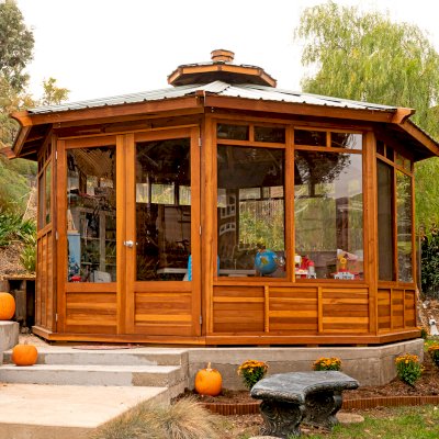 Octagonal Sunroom Gazebo (Options: 16' Diameter, Internal Deck, California Redwood, 24" H Siding Below Windows, 4 Standard Window Panels & 3 Custom Panels, Clear Acrylic, 1 Ceiling Fan Base, 1 Set of Doors, Transparent Premium Sealant). Photo Courtesy of D. Coons of Morgan Hill, California.