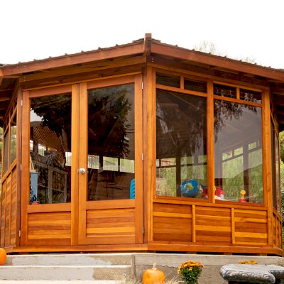 Octagonal Sunroom Gazebo (Options: 16' Diameter, Internal Deck, California Redwood, 24" H Siding Below Windows, 4 Standard Window Panels & 3 Custom Panels, Clear Acrylic, 1 Ceiling Fan Base, 1 Set of Doors, Transparent Premium Sealant). Photo Courtesy of D. Coons of Morgan Hill, California.