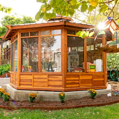 Octagonal Sunroom Gazebo (Options: 16' Diameter, Internal Deck, California Redwood, 24" H Siding Below Windows, 4 Standard Window Panels & 3 Custom Panels, Clear Acrylic, 1 Ceiling Fan Base, 1 Set of Doors, Transparent Premium Sealant). Photo Courtesy of D. Coons of Morgan Hill, California.
