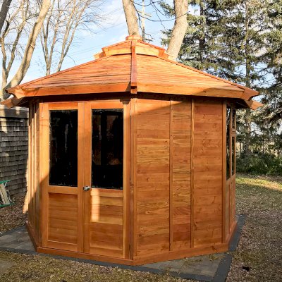 Octagonal Sunroom Gazebo (Options: 12', Deck, Douglas-fir, 36" H Siding Below Windows, Standard Wood Roof, 4 Window Panels, Single Door, Transparent Premium Sealant). Photo Courtesy of R. Voyles of Aberdeen, South Dakota.