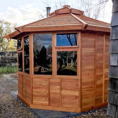 Octagonal Sunroom Gazebo (Options: 12', Deck, Douglas-fir, 36" H Siding Below Windows, Standard Wood Roof, 4 Window Panels, Single Door, Transparent Premium Sealant). Photo Courtesy of R. Voyles of Aberdeen, South Dakota.