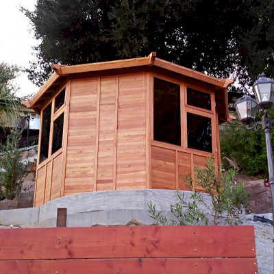 Octagonal Sunroom Gazebo (Options: 12' Diameter, No Deck, Douglas-fir, 36" H Siding Below Windows, 4 Window Panels & Solid Panels, 2 Sets of Doors, Transparent Premium Sealant). Photo Courtesy of Y. Fang of Diamond Bar, CA.