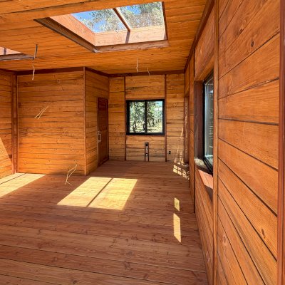Custom Palo Alto Backyard Cabin (Options: 18' L, 16' W, With 19' x 19' Structural Deck with Steps, California Redwood for Exterior Finished, Douglas-fir Internal Walls and Framing, Double Door, Slidding Windows, Windows Purchased Locally, With Two 2' x 2' Skylights, Metal Roof, Electrical Wire Trim on the Walls, Transparent Premium Sealant). Photo Courtesy of R. & M. Hegwood of Ceres, CA.