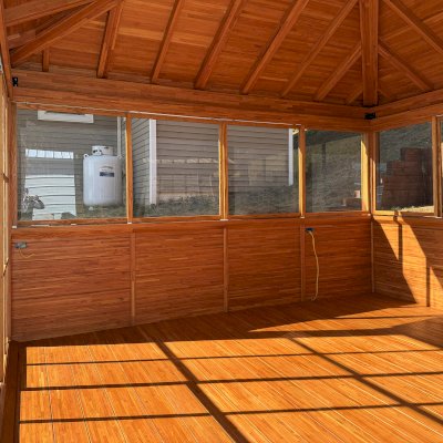 Sun Gazebo with Sliding Doors (Options: 16' L x 14' W, Mosaic Douglas, 8 ft Wall Height, No Skylight, with 2 Sliding Walls, 2 Custom Windows, Complete Floor, No Roofing, Transparent Premium Sealant). Photo Courtesy of K. Biederman of Whitehorn, CA.