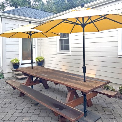 Heritage Large Wooden Picnic Table (Options: 10' L, 34 1/2" W, Side Benches, Attached Benches, Standard Tabletop, Rounded Corners, 2 Umbrella Holes of 2", Transparent Premium Sealant). Photo Taken 1 Year After Installation. Photo Courtesy of M. Nelson of Greensboro, NC.