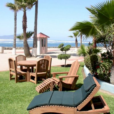 Penny Wooden Sun Lounger (Options: Single, Mature Redwood, Snack Tray on Right Side, 13" H, Wheels, Custom 2" thick Cushion in 7 sections, Transparent Premium Sealant).Photo Courtesy of Estero Beach Resort of Ensenada, Mexico.