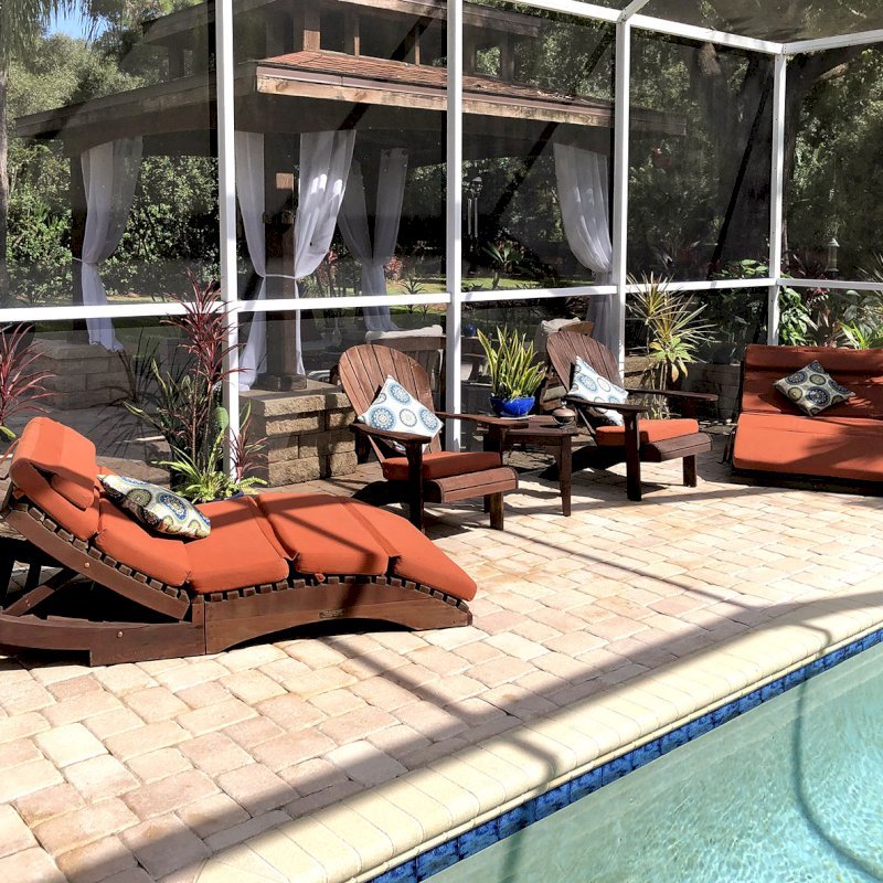 Penny Wooden Sun Lounger (Options: Honeymoon, Standard 72", Redwood, No Snack Trays, 13" H, No Wheels, 3" thick Cushion, 5 Section Cushion, Coffee-Stain Premium Sealant). Photo Courtesy of Mark and Dorit Stone of Odessa, Florida. Penny Wooden Sun Lounger (Options: Honeymoon, Standard 72", Redwood, No Snack Trays, 13" H, No Wheels, 3" thick Cushion, 5 Section Cushion, Coffee-Stain Premium Sealant). Photo Courtesy of Mark and Dorit Stone of Odessa, Florida.
