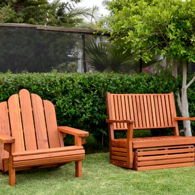 Porter Thayer Wooden Glider (Options: Double, Mature Redwood, No Cushion, Transparent Premium Sealant). Photo also shows an Adirondack chair Extra Wide.