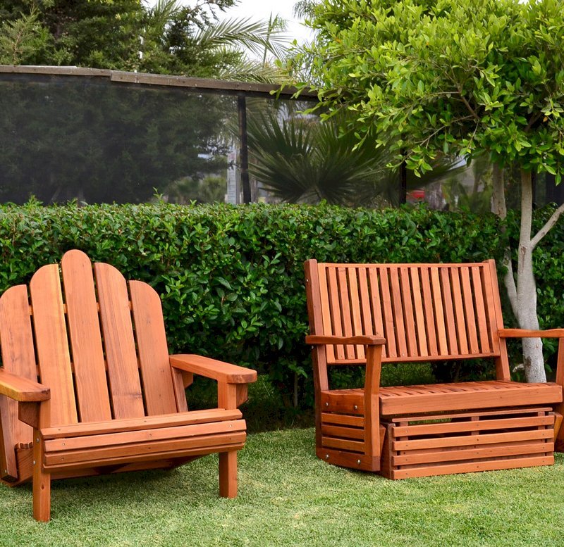 Porter Thayer Glider (Options: Double, Mature Redwood, No Cushion, Transparent Premium Sealant). Photo also shows an Adirondack chair Extra Wide. Porter Thayer Glider (Options: Double, Mature Redwood, No Cushion, Transparent Premium Sealant). Photo also shows an Adirondack chair Extra Wide.