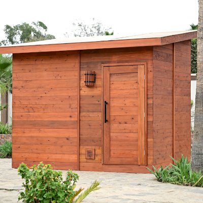 Raul’s Rad Redwood Sauna (Options: 11' W, 8' D, 11' H, California Redwood (for Interiors) & Mature Redwood (for Exteriors), Pitch Roof for Exterior Areas, "L" Shape Bench (2 levels), Transparent Premium Sealant).