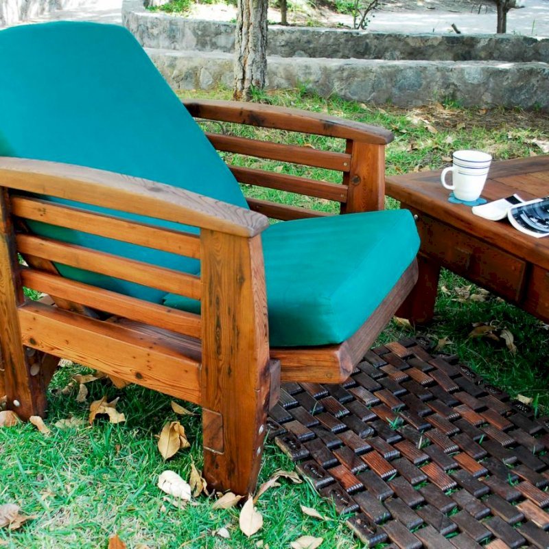Reclining Redwood Easy Chair (Options: Old-Growth Redwood, 4" Cushion, Transparent Premium Sealant). Photo shows easy chair in reclined position with Flexible Floor Mat (Mature Redwood with Coffee Stain) and Coffee Table (Old-Growth Redwood with Transparent Premium Sealant). Reclining Redwood Easy Chair (Options: Old-Growth Redwood, 4" Cushion, Transparent Premium Sealant). Photo shows easy chair in reclined position with Flexible Floor Mat (Mature Redwood with Coffee Stain) and Coffee Table (Old-Growth Redwood with Transparent Premium Sealant).