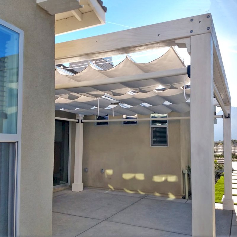 Retractable Canopy Pergola (Options: 16' L x 15' W, No Privacy Panel, Douglas-Fir, 9.5 ft Post Height, 1 Electrical Wiring Trim, Post Anchor Kit for Concrete, No Post Decorative Trim, 1 Ceiling Fan Base, 4 Curtain Rods, Off-White Oil-Based Primer). Photo Courtesy of M. Tiffany of Palm Springs , CA. Retractable Canopy Pergola (Options: 16' L x 15' W, No Privacy Panel, Douglas-Fir, 9.5 ft Post Height, 1 Electrical Wiring Trim, Post Anchor Kit for Concrete, No Post Decorative Trim, 1 Ceiling Fan Base, 4 Curtain Rods, Off-White Oil-Based Primer). Photo Courtesy of M. Tiffany of Palm Springs , CA.