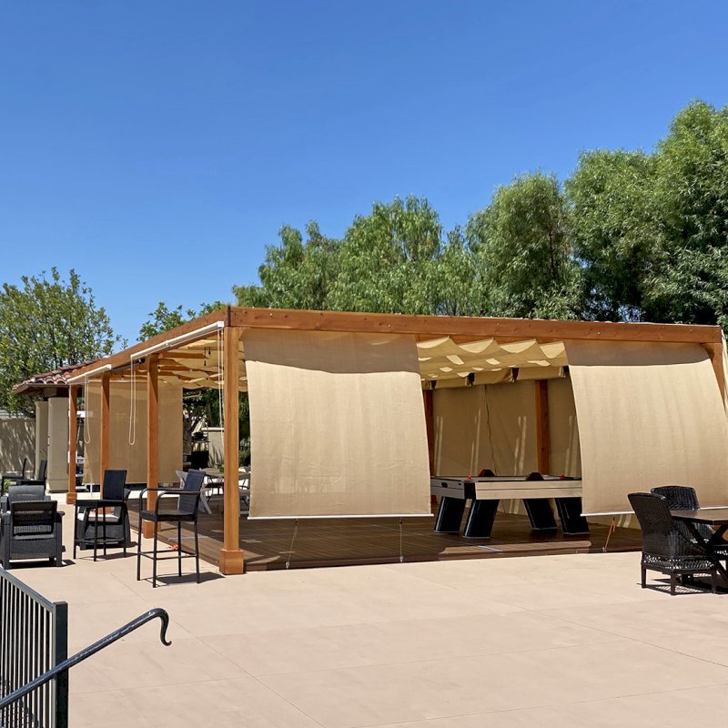 Retractable Canopy Pergola (Options: 24' W x 40' L, Douglas-fir, 8-post kit for Concrete, Transparent Premium Sealant). Photo Courtesy of El Paseo Tennis Club of Valencia, CA. Retractable Canopy Pergola (Options: 24' W x 40' L, Douglas-fir, 8-post kit for Concrete, Transparent Premium Sealant). Photo Courtesy of El Paseo Tennis Club of Valencia, CA.