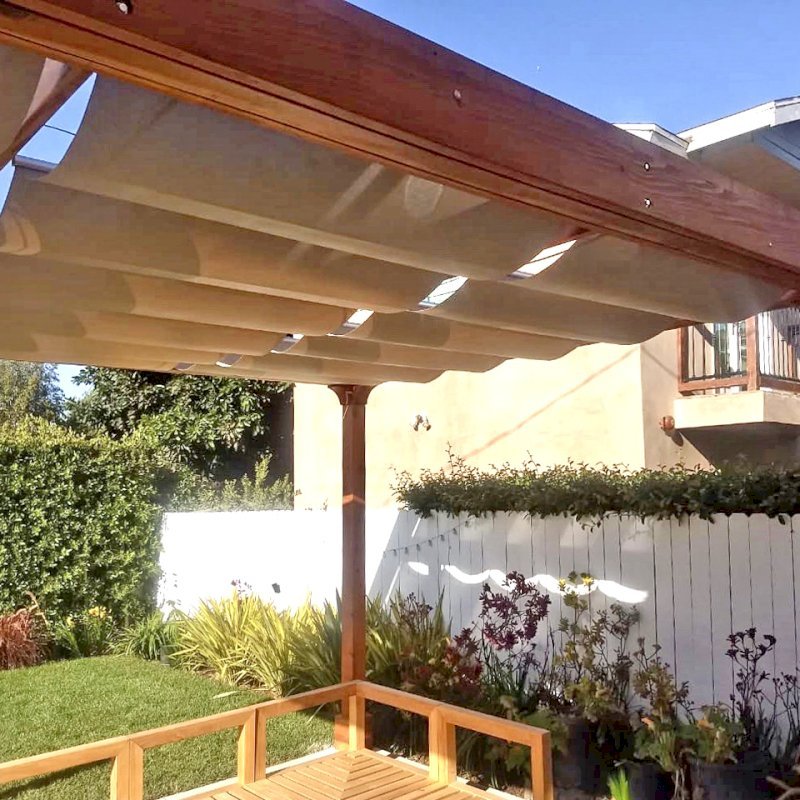 Retractable Canopy Pergola (Options: 18' L x 14' W, No Privacy Panel, California Redwood, 10' Post Height, 1 Electrical Wiring Trim, Post Anchor Kit for Concrete, No Post Decorative Trim, No Ceiling Fan Base, No Curtain Rods Transparent Premium Sealant). Photo Courtesy of D. Evans of Los Angeles, California. Retractable Canopy Pergola (Options: 18' L x 14' W, No Privacy Panel, California Redwood, 10' Post Height, 1 Electrical Wiring Trim, Post Anchor Kit for Concrete, No Post Decorative Trim, No Ceiling Fan Base, No Curtain Rods Transparent Premium Sealant). Photo Courtesy of D. Evans of Los Angeles, California.