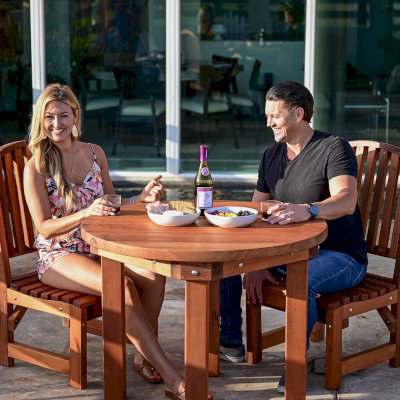 Round Outdoor Patio Table (Options: 3 1/2', 2 Chairs, Mature Redwood, Luna Chairs, No Cushions, Side Chairs only (no arms), Standard Tabletop, No Lazy Susan, No Umbrella Hole, Transparent Premium Sealant).  Photo Courtesy of The Estero Beach Resort of Ensenada, Mexico. 