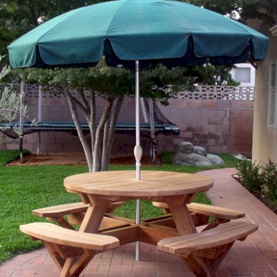 Round Wooden Picnic Tables (Attached Benches) (Options: 4.5' Diameter, Attached Benches,  Mature Redwood, Standard Tabletop, No Lazy Susan, Umbrella Hole & Plug, Unfinished). We do not sell umbrellas, but we can drill an umbrella hole for you.