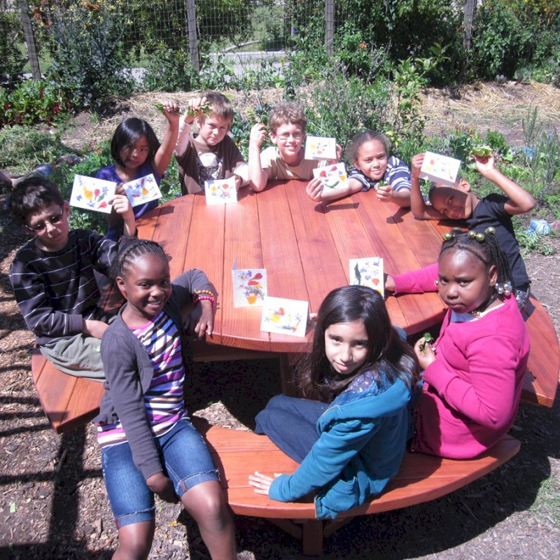 Round Wooden Picnic Tables (Attached Benches) (Options: 5' Diameter, Attached Benches, Redwood, Standard Tabletop, No Lazy Susan, No Umbrella Hole, Transparent Premium Sealant). Photo courtesy of Rivka M. of Berkeley, CA. Round Wooden Picnic Tables (Attached Benches) (Options: 5' Diameter, Attached Benches, Redwood, Standard Tabletop, No Lazy Susan, No Umbrella Hole, Transparent Premium Sealant). Photo courtesy of Rivka M. of Berkeley, CA.