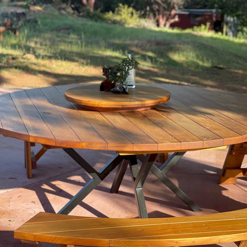 Round Wooden Picnic Tables (Detached Benches) with Custom Steel Pedestal Leg Design (Options: 7' diameter, California Redwood, Arc Picnic Bench, Standard Tabletop, with Lazy Susan, No Umbrella Hole, Transparent Premium Sealant). Photo Courtesy of Alex P. of Lower Lake, CA. Round Wooden Picnic Tables (Detached Benches) with Custom Steel Pedestal Leg Design (Options: 7' diameter, California Redwood, Arc Picnic Bench, Standard Tabletop, with Lazy Susan, No Umbrella Hole, Transparent Premium Sealant). Photo Courtesy of Alex P. of Lower Lake, CA.