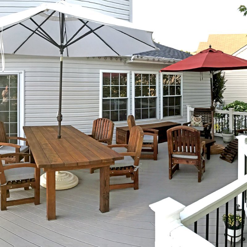 San Francisco Redwood Patio Table (Options: 8' L, 40 1/4" W Tabletop, Chairs, Mature Redwood, 6 Chairs, Luna Chair Design, All Armchairs, Custom Color Cushions, Standard Tabletop, Rounded Corners, 2" Umbrella Hole, Transparent Premium Sealant). Furniture was 2 years old when the photo was taken. Photo Courtesy of Martin Holbrook of Forest Hill, Maryland. San Francisco Redwood Patio Table (Options: 8' L, 40 1/4" W Tabletop, Chairs, Mature Redwood, 6 Chairs, Luna Chair Design, All Armchairs, Custom Color Cushions, Standard Tabletop, Rounded Corners, 2" Umbrella Hole, Transparent Premium Sealant). Furniture was 2 years old when the photo was taken. Photo Courtesy of Martin Holbrook of Forest Hill, Maryland.