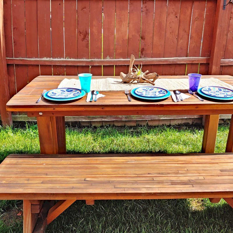 San Francisco Redwood Patio Table (Options: 6' L, 34 1/2" W Tabletop, Classic Picnic Benches, Mosaic Eco-Wood, 1 Full Length Bench Per Side, Bench Seats 17" Wide Instead of 11 1/2" Wide per Custom Request, No Cushions, Standard Tabletop, Squared Corners, No Umbrella Hole, Transparent Premium Sealant). Photo Courtesy of P. Oberhaus of Alliance, Ohio. San Francisco Redwood Patio Table (Options: 6' L, 34 1/2" W Tabletop, Classic Picnic Benches, Mosaic Eco-Wood, 1 Full Length Bench Per Side, Bench Seats 17" Wide Instead of 11 1/2" Wide per Custom Request, No Cushions, Standard Tabletop, Squared Corners, No Umbrella Hole, Transparent Premium Sealant). Photo Courtesy of P. Oberhaus of Alliance, Ohio.