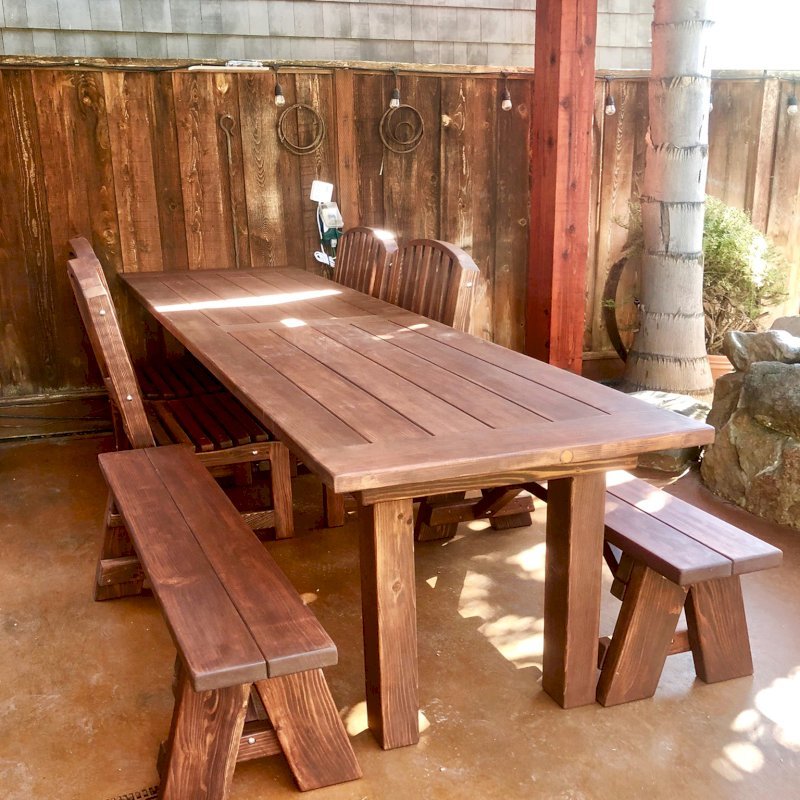 San Francisco Redwood Patio Table (Options: 8' L, 34 1/2" W Tabletop, Chairs, California Redwood, Benches & Chairs, Luna Chair Design, Two 4' benches, 4 Luna Dining Chairs and One Armchair, No Cushions, Old Country Tabletop, Standard, Squared Corners, No Umbrella Hole, Coffee-Stain Premium Sealant). Photo Courtesy of S. Perreira of Hollister, California. San Francisco Redwood Patio Table (Options: 8' L, 34 1/2" W Tabletop, Chairs, California Redwood, Benches & Chairs, Luna Chair Design, Two 4' benches, 4 Luna Dining Chairs and One Armchair, No Cushions, Old Country Tabletop, Standard, Squared Corners, No Umbrella Hole, Coffee-Stain Premium Sealant). Photo Courtesy of S. Perreira of Hollister, California.