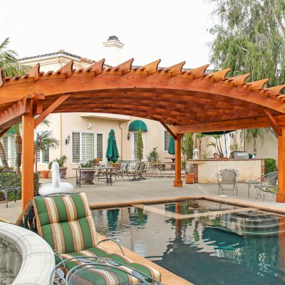 Sebastopol Pergolas (Options: 26' L x 24' Arc W, Mature Redwood, 4-Post Anchor Kit for High-Wind, Transparent Premium Sealant). Photo Courtesy of Ms. Diane Williams of Encinitas, CA. Photo shows extra large timber custom design with 8x8 posts and 2x10 arches, 26 ft long.