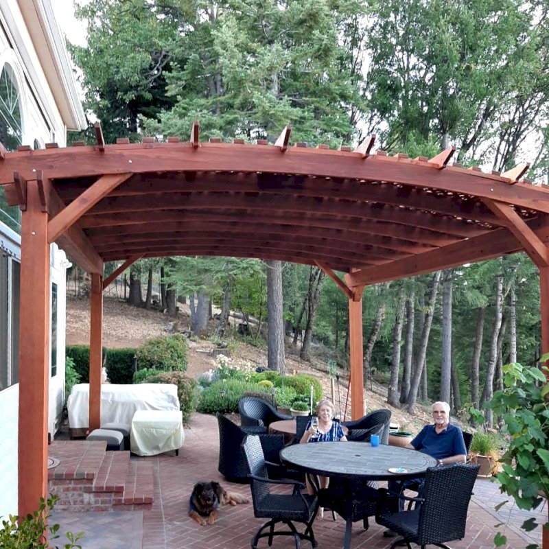 Custom Sebastopol Pergolas (Options: 20' L x 18' Arc W, California Redwood, 4-Post Anchor Kit for Concrete, with Lattice Panels by Custom Request, No Ceiling Fan Base, 10' H Posts, Transparent Premium Sealant). Photo Courtesy of E. Greenwood of Nevada City, California. Custom Sebastopol Pergolas (Options: 20' L x 18' Arc W, California Redwood, 4-Post Anchor Kit for Concrete, with Lattice Panels by Custom Request, No Ceiling Fan Base, 10' H Posts, Transparent Premium Sealant). Photo Courtesy of E. Greenwood of Nevada City, California.
