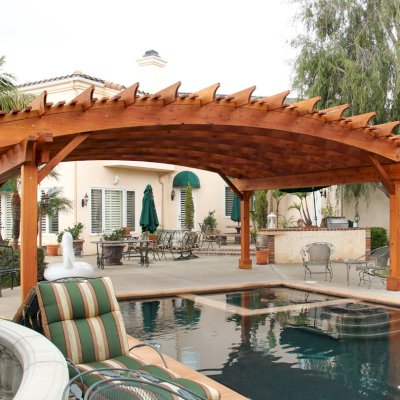 Sebastopol Pergolas (Options: 26' L x 24' Arc W, Mature Redwood, 4-Post Anchor Kit for High-Wind, Transparent Premium Sealant). Photo Courtesy of Ms. Diane Williams of Encinitas, CA. Photo shows extra large timber custom design with 8x8 posts and 2x10 arches, 26 ft long.