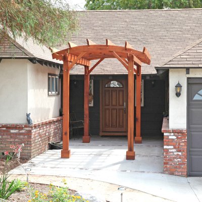 Small Arched Open Sky Pergolas (Options: 15' L x 8' W, No Privacy Panels, Mature Redwood, No Rain Guard, 8.5 ft Post Height, No Electrical Wiring Trim, No Post Decorative Trim, 4-Post Anchor Kit for Concrete, No Curtain Rods, No Retractable Shade Canopy, Transparent Premium Sealant). Photo Courtesy of B. McCusker of Glendora, CA.