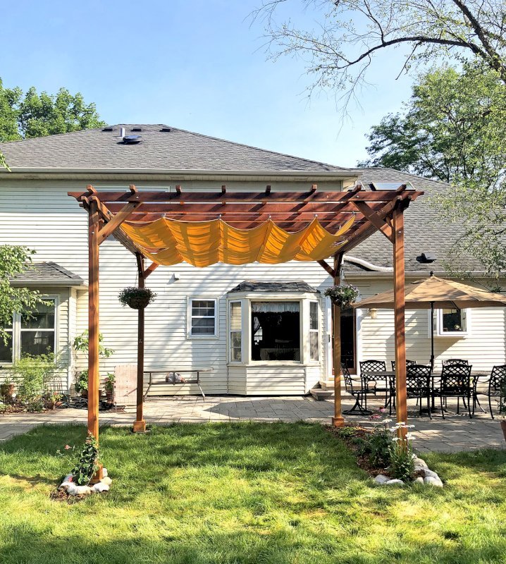 Small Garden Pergola Kit (Options: 12' L x 12' W, No Privacy Panels, California Redwood, 9.5' Post height, 4-Post Anchor Kit for Gale-Wind, No Curtain Rods, No Decorative Trims, Transparent Premium Sealant). Custom Canopy purchased form Infinity Canopy. Photo Courtesy of J. Minniti of Lisle, Illinois. Small Garden Pergola Kit (Options: 12' L x 12' W, No Privacy Panels, California Redwood, 9.5' Post height, 4-Post Anchor Kit for Gale-Wind, No Curtain Rods, No Decorative Trims, Transparent Premium Sealant). Custom Canopy purchased form Infinity Canopy. Photo Courtesy of J. Minniti of Lisle, Illinois.