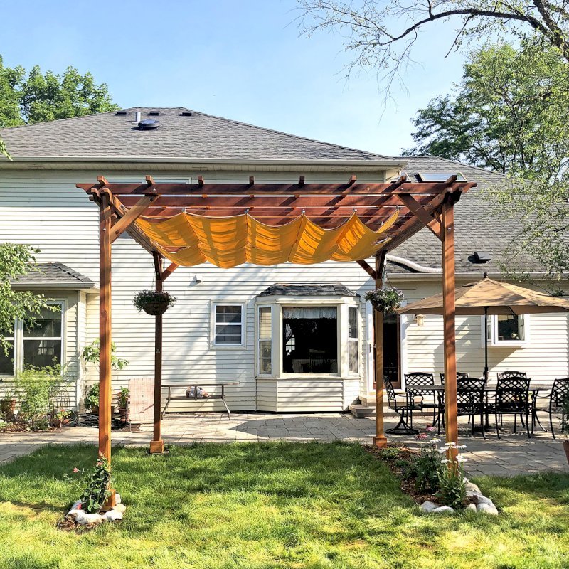Small Pergola (Options: 12' x 12', Garden Type, Standard Timbers, California Redwood, Open Roof, 9.5 ft Post Height, 4-Post Anchor Kit for Gale-Wind, No Ceiling Fan Base, No Louver Privacy Panels, No Curtain Rods, Transparent Premium Sealant). Canopy purchased from Infinity Canopy. Photo Courtesy of J. Minniti of Lisle, Illinois. Small Pergola (Options: 12' x 12', Garden Type, Standard Timbers, California Redwood, Open Roof, 9.5 ft Post Height, 4-Post Anchor Kit for Gale-Wind, No Ceiling Fan Base, No Louver Privacy Panels, No Curtain Rods, Transparent Premium Sealant). Canopy purchased from Infinity Canopy. Photo Courtesy of J. Minniti of Lisle, Illinois.
