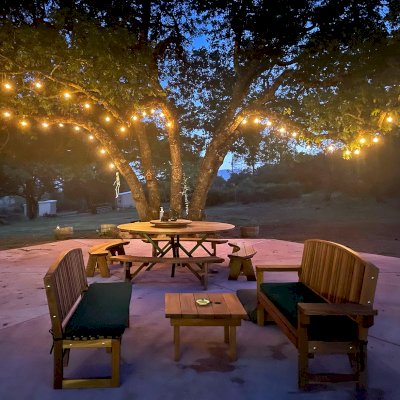 Square Side Table (Options: 30" Size, California Redwood, Slightly Rounded Corners, 18" H, Transparent Premium Sealant). Photo also shows 2 Moonlight Benches and a Custom Round Picnic Table Set. Photo Courtesy of A. Paul of Lower Lake, CA.