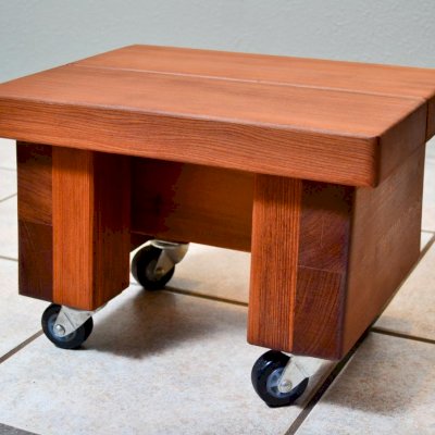 Small Wooden Foot Stool (Options: Mature Redwood, 12"H, No Engraving, Transparent Premium Sealant). Photo shows custom casters. If you'd like a set of casters added, let us know ($30).